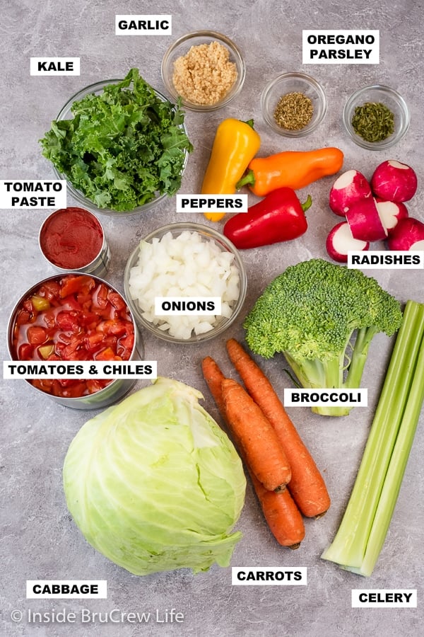 Overhead picture of a gray board with the ingredients needed to make a low carb vegetable soup.