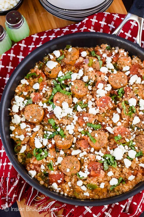 Tomato Basil Cauliflower Rice and Sausage - this easy one pan skillet dinner is loaded with tomatoes, basil, and sausage. It's a healthy and easy recipe that can be on the dinner table in under 30 minutes. #cauliflower #tomatobasil #leanandgreen #healthydinner #chickensausage