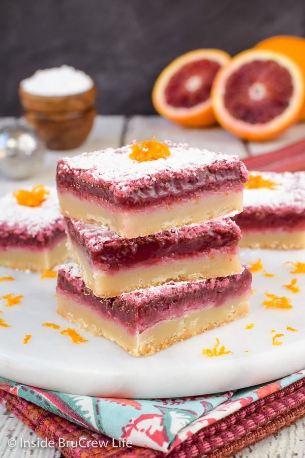 A white board with stacks of blood orange bars on it.