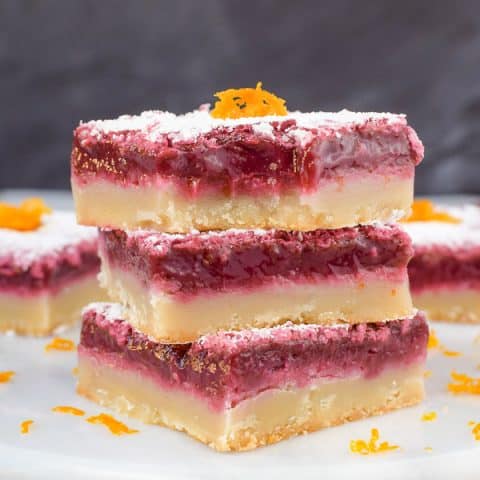 A stack of three blood orange bars on a white board.