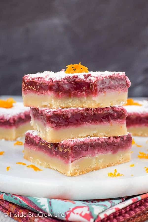 A stack of three blood orange bars on a white tray.