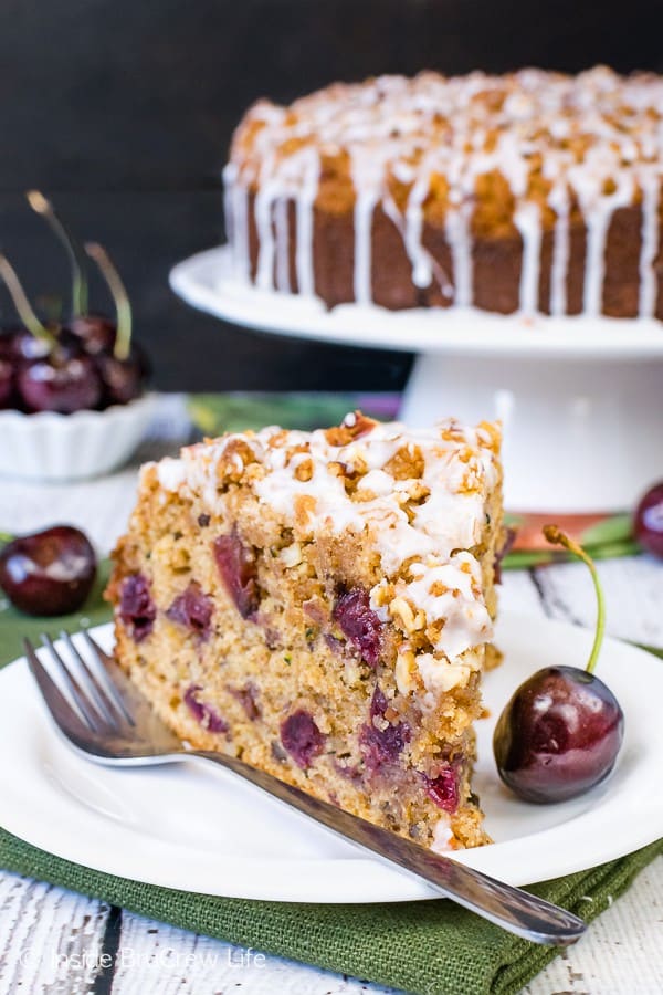 Cherry Zucchini Coffee Cake - this sweet breakfast cake is full of fruits and veggies and topped with the most amazing crumble and glaze. Try this easy recipe for breakfast or brunch. #coffeecake #cherry #zucchini #breakfast #brunchrecipes