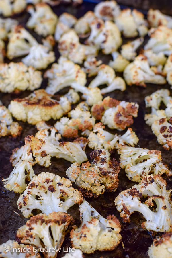 Oven Roasted Cauliflower - this easy roasted cauliflower is a delicious and healthy side dish. Perfect recipe to add to any lean protein for a great lean and green meal. #cauliflower #leanandgreen #healthy #roastedveggies #roastedcauliflower