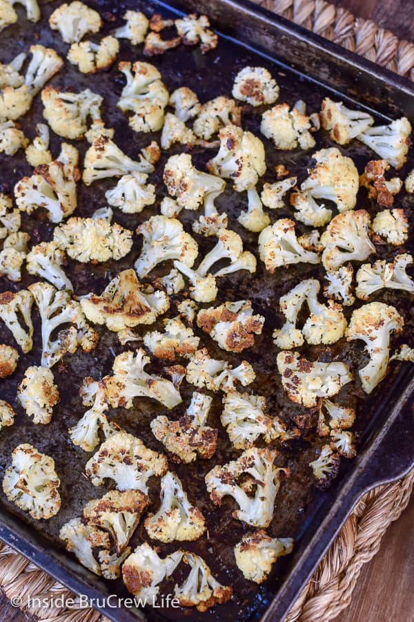 Oven Roasted Cauliflower - this easy roasted cauliflower is a delicious addition to any lean protein. Make and serve this easy recipe as a side dish! #cauliflower #leanandgreen #healthy #roastedveggies #roastedcauliflower