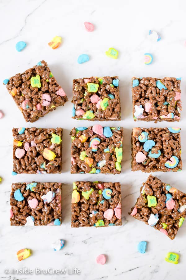 Squares of chocolate lucky charms on a white board.