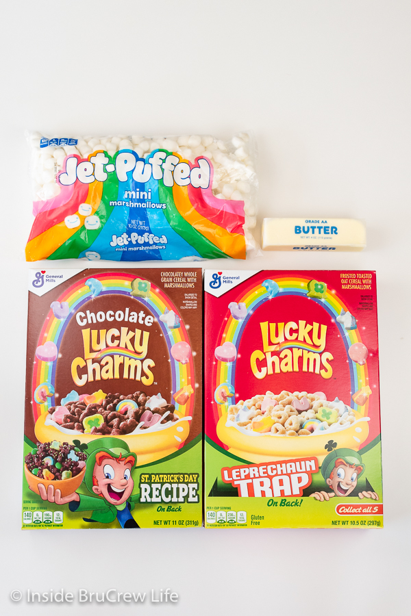 A white board with ingredients needed to make lucky charms treats.