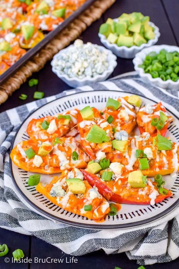 Buffalo Chicken Pepper Nachos - use mini peppers as the base for buffalo chicken and cheese to make this easy low carb appetizer #buffalochicken #lowcarb #appetizer #healthy #sheetpanmeal 