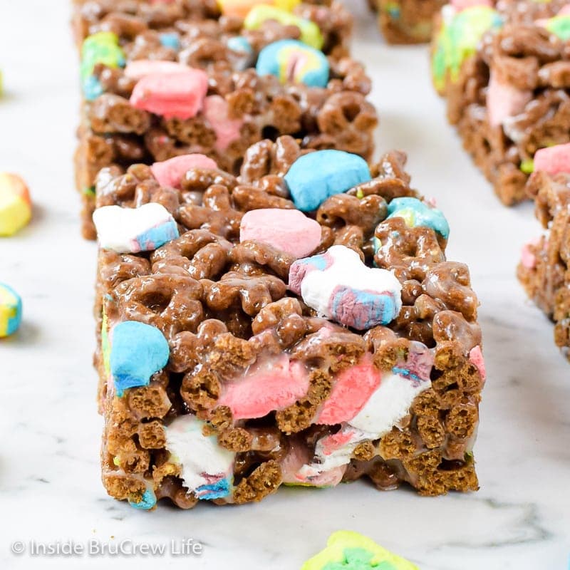 A chocolate cereal treat made with lots of colorful Lucky Charms marshmallows.