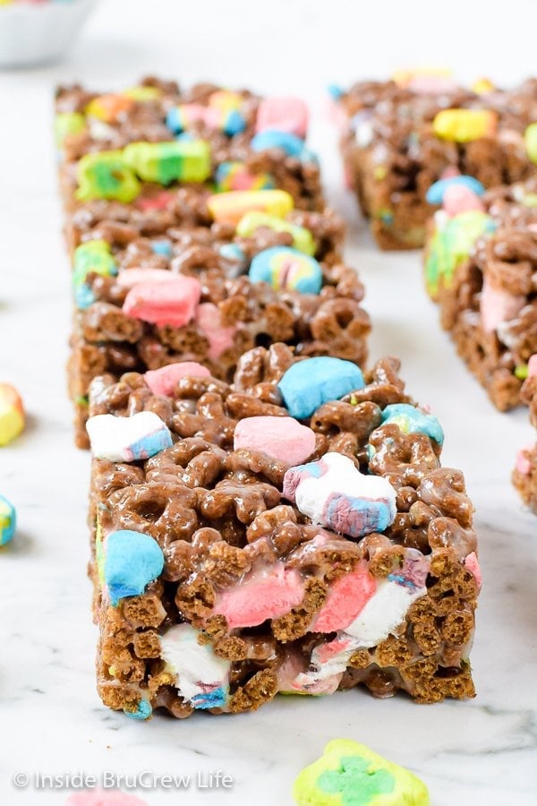 Marshmallow cereal bars on a white board.