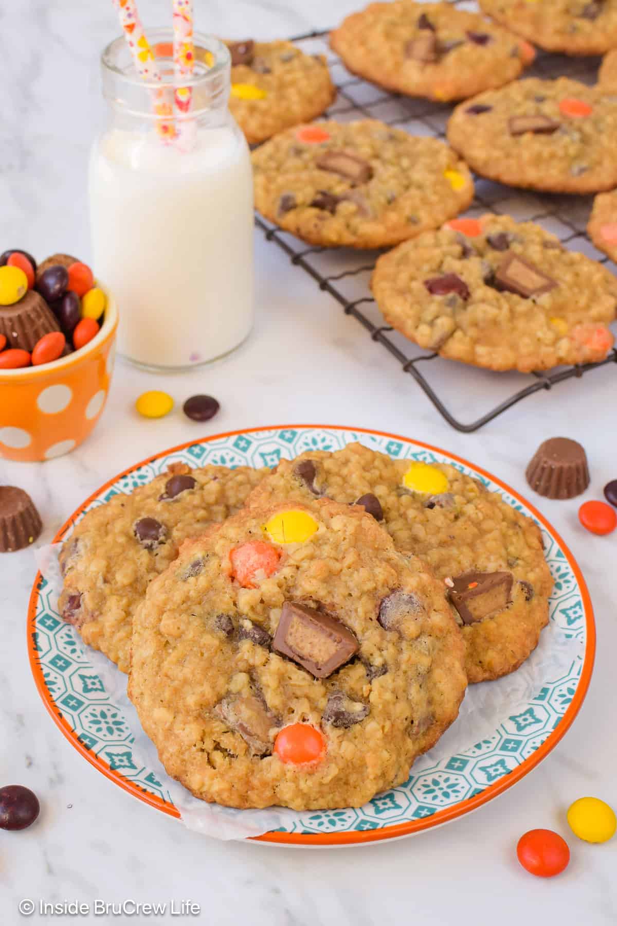 Three thin and chewy peanut butter and banana cookies on a plate.