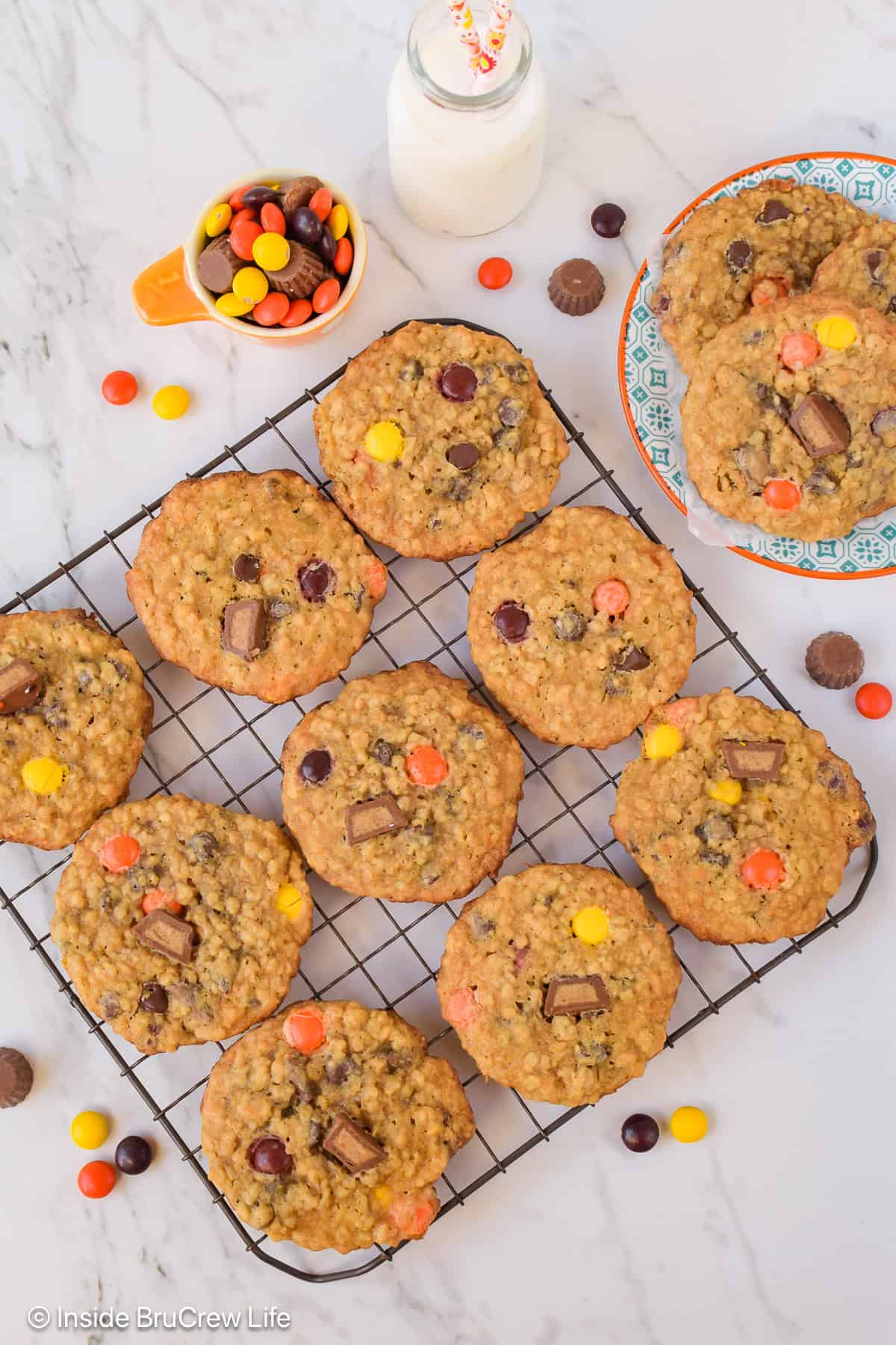 A wire rack with peanut butter banana oatmeal cookies cooling on it.