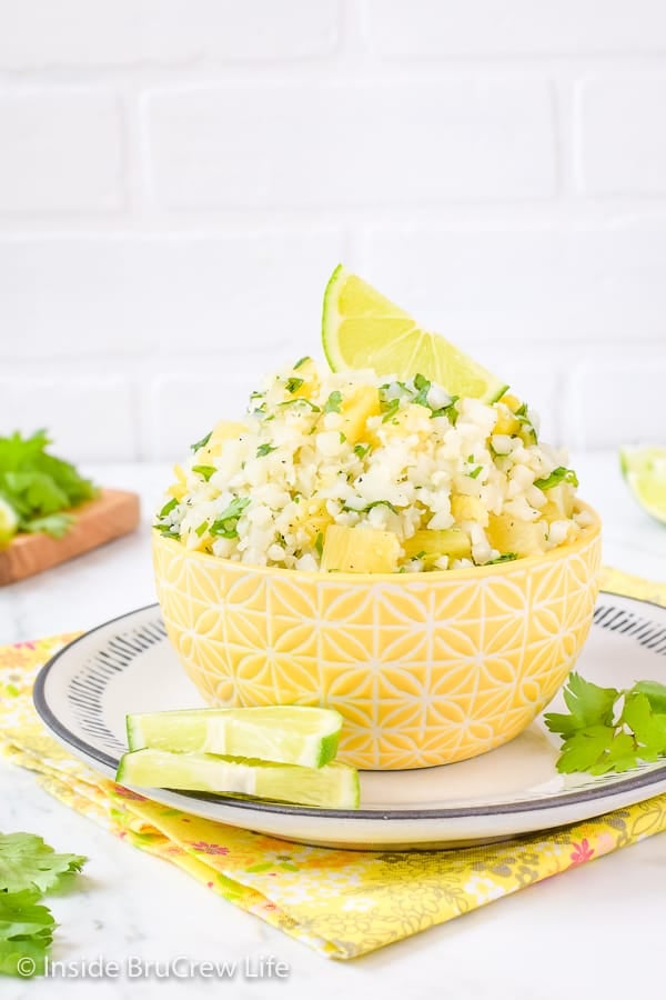 Pineapple Lime Cauliflower Rice - adding pineapple and lime gives this easy cauliflower rice a sweet and tropical flavor. Enjoy it with tacos, fish, or grilled chicken! #healthy #cauliflower #pineapple #rice