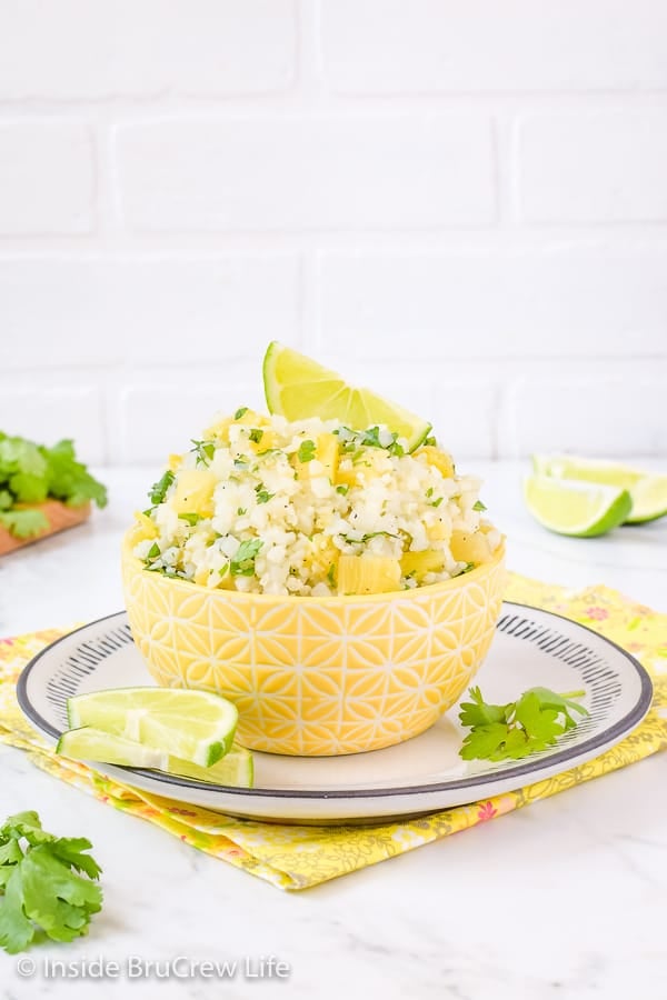 Pineapple Lime Cauliflower Rice - adding pineapple and lime to a bowl of easy cauliflower rice adds a delicious tropical flavor. Make this healthy recipe to enjoy with fish, tacos, or grilled chicken dinners! #healthy #cauliflower #pineapple #rice