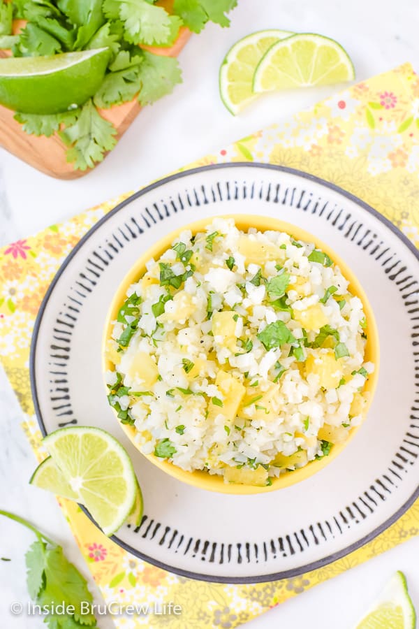 Pineapple Lime Cauliflower Rice - lime and pineapple gives this easy cauliflower rice a sweet and tropical flavor. Make it to go with your tacos, fish, or grilled chicken dinners! #healthy #cauliflower #pineapple #rice