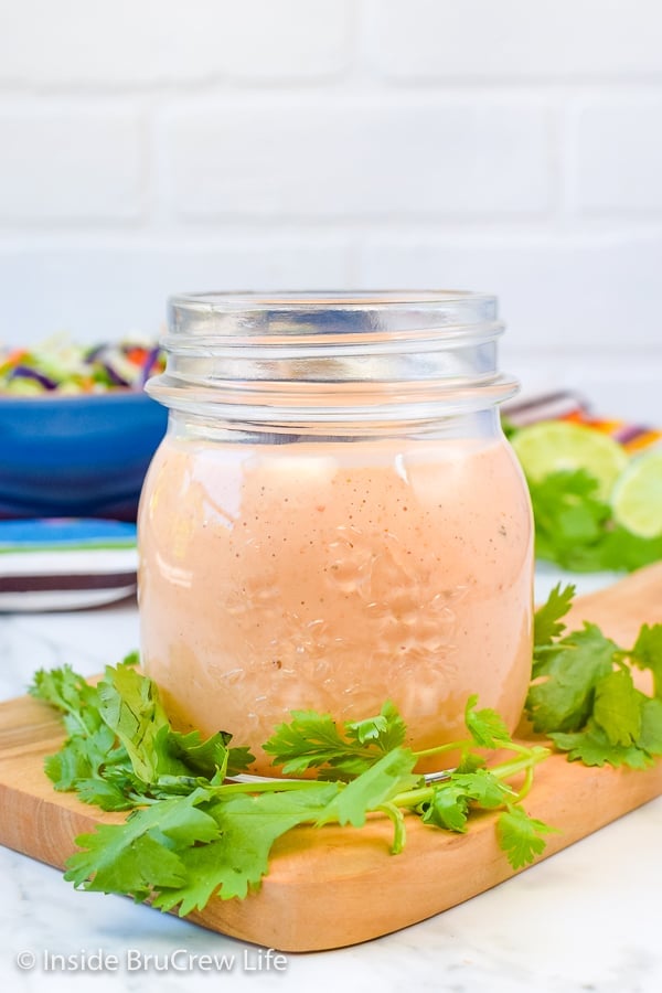 Sweet and Spicy Coleslaw - this easy coleslaw has a great sweet and spicy flavor from the honey and Sriracha dressing. Try this easy recipe with pork or fish dinners! #coleslaw #sweetandspicy #sriracha #honey #summer #potluck