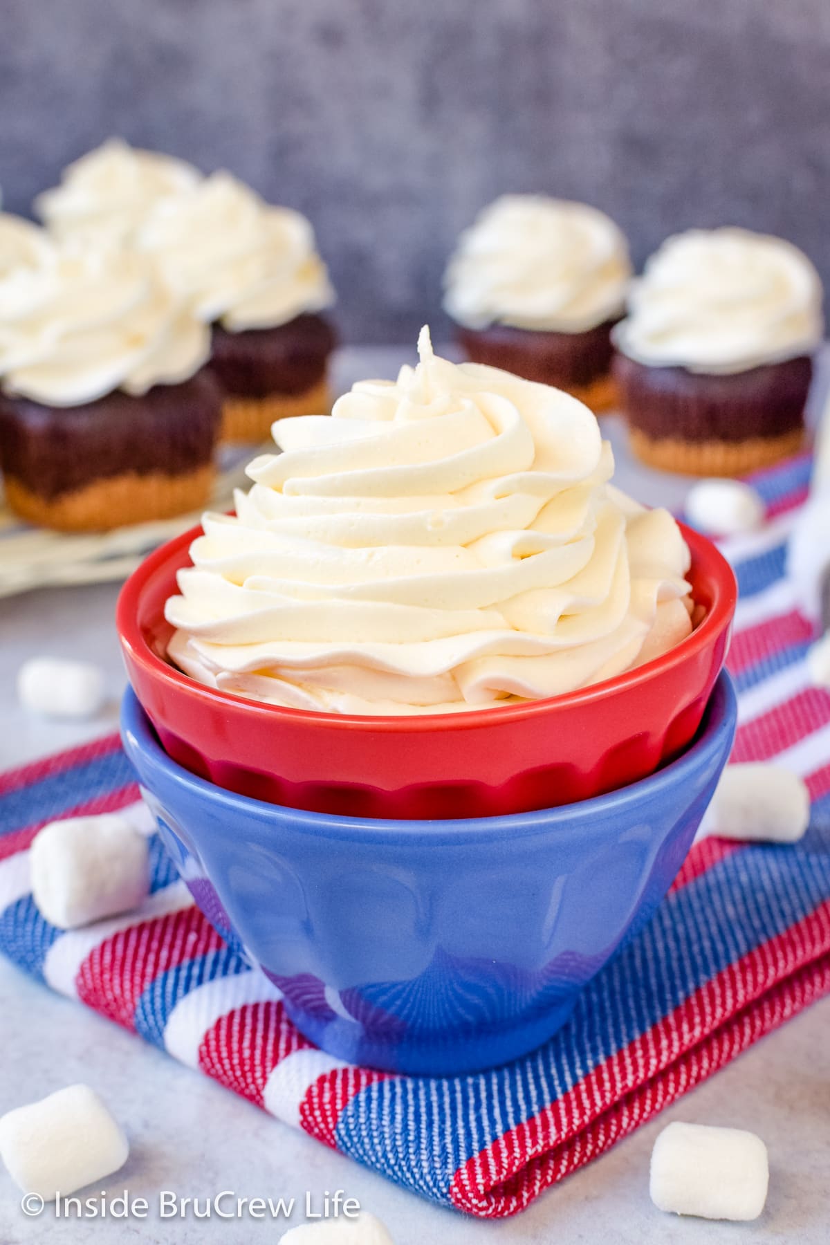 A swirl of frosting in a red and blue bowl.