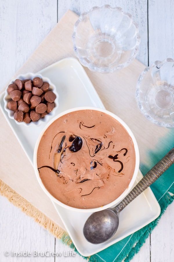 Chocolate Peanut Butter Cup Ice Cream - candies, cookies, and fudge add a fun flair to this easy homemade chocolate ice cream! Easy recipe for a hot summer day! #icecream #chocolate #peanutbuttercups #homemadeicecream #eggfree #Oreos #peanutbutter #icecreamday