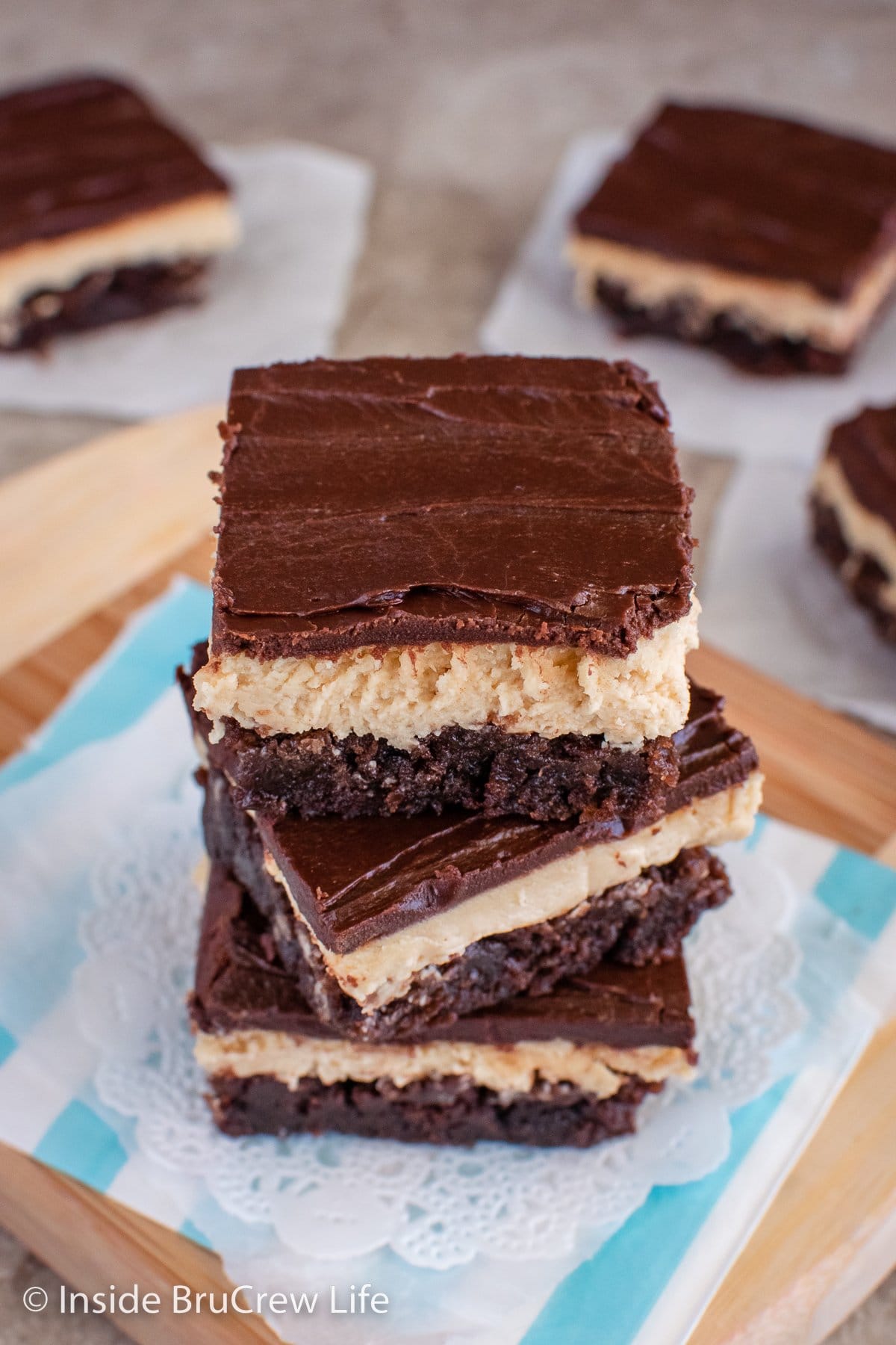 A stack of chocolate peanut butter brownies.
