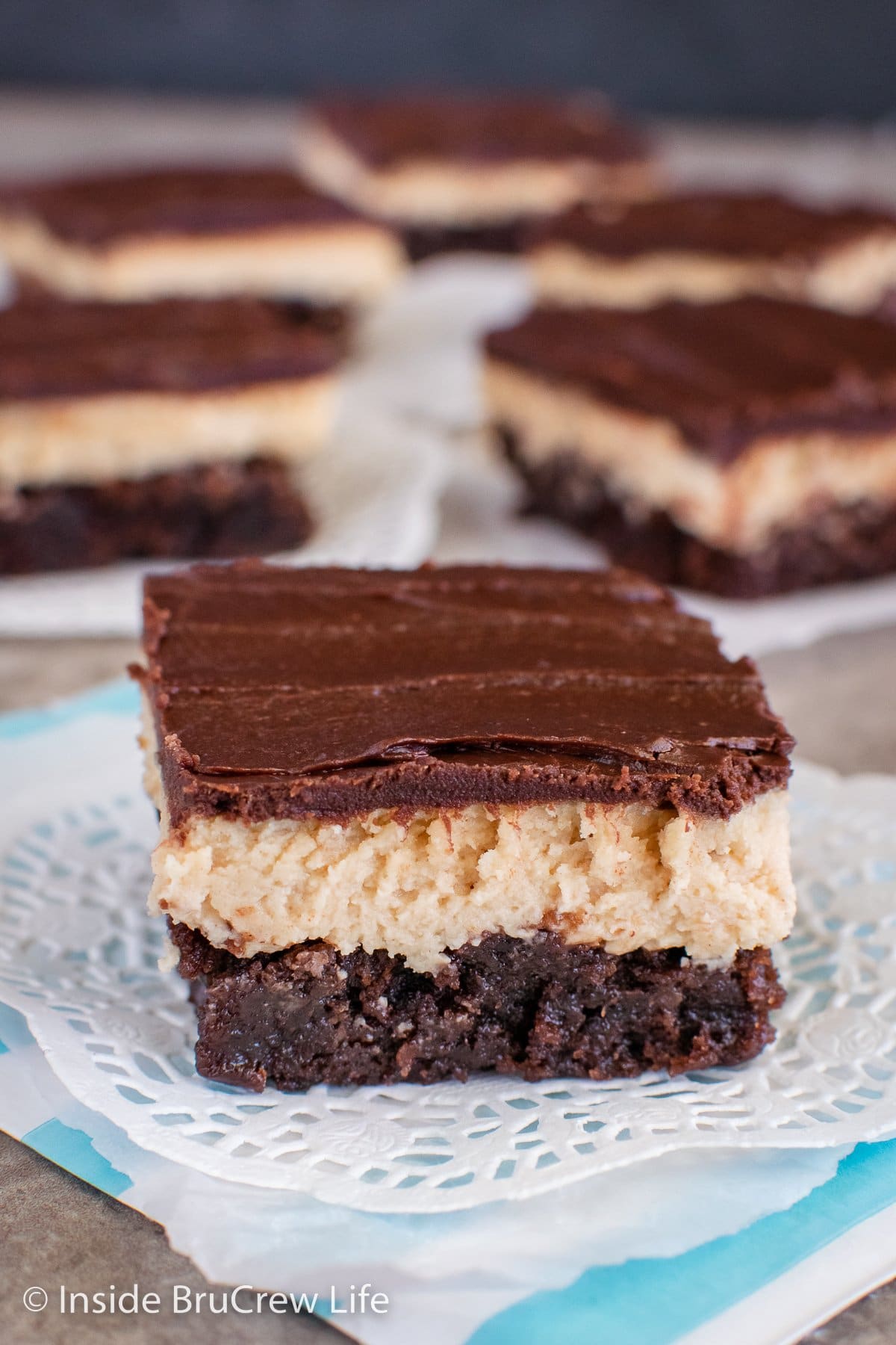 Squares of peanut butter truffle brownies on a tray.