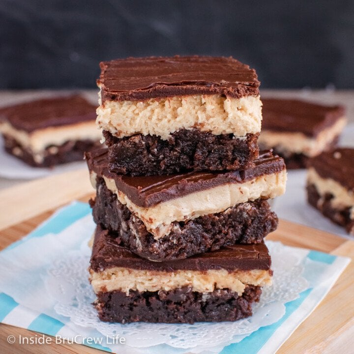 Three chocolate peanut butter brownies stacked on top of each other.