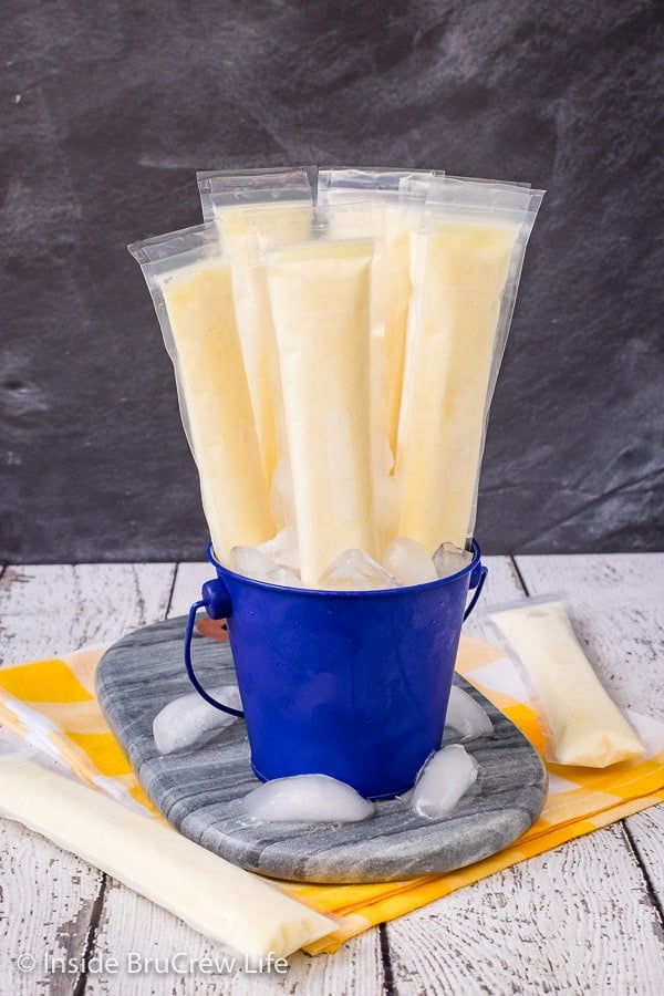 Easy Dole Whip Popsicles - these easy homemade popsicles taste just like the popular Disney dessert. Try this easy recipe for hot summer days! #copycat #disney #dolewhip #popsicles #summerdessert #summerfun #summervibes #pineapple