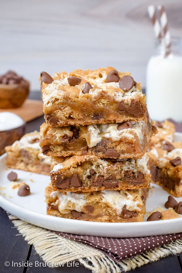 A stack of s'mores blondies on a white plate.