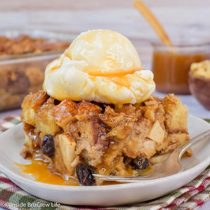 A square of apple dessert casserole topped with ice cream and caramel.