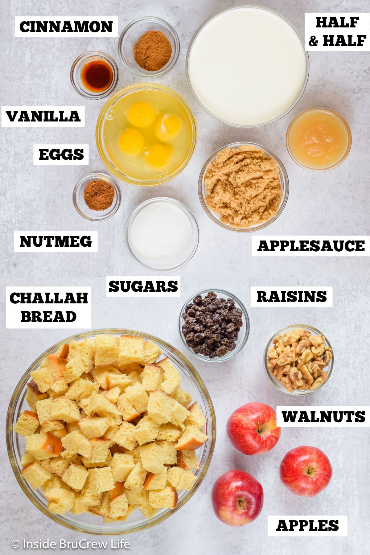 A white board with bowls of ingredients needed to make an apple dessert casserole.