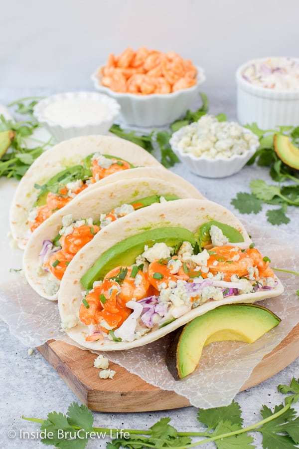 Easy Buffalo Shrimp Tacos - easy shrimp tacos filled with your favorite toppings makes an easy and delicious dinner on busy nights. #tacos #buffaloshrimp #shrimptacos #tacotuesday