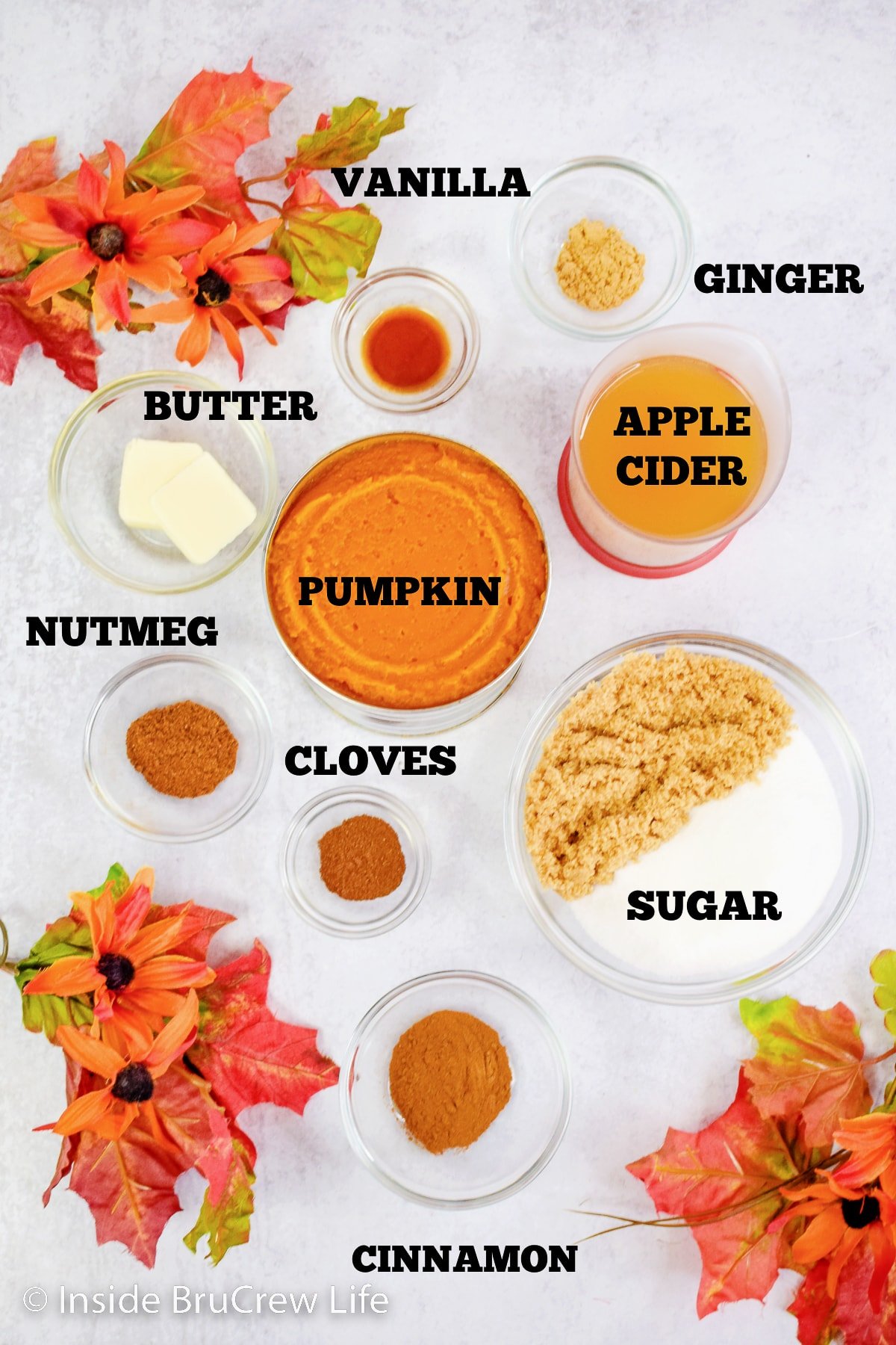 A white board with ingredients needed to make pumpkin butter on it.