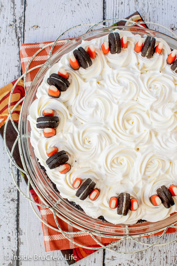 No Bake Halloween Oreo Cream Pie - this fun Halloween cream pie has four layers of striped dessert goodness. Try this easy recipe for Halloween parties.