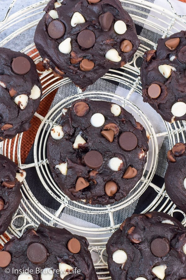 Overhead picture of chocolate pumpkin cookies on a white cooling rack.