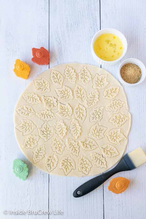 Overhead picture of pie crust with leaf imprints on it