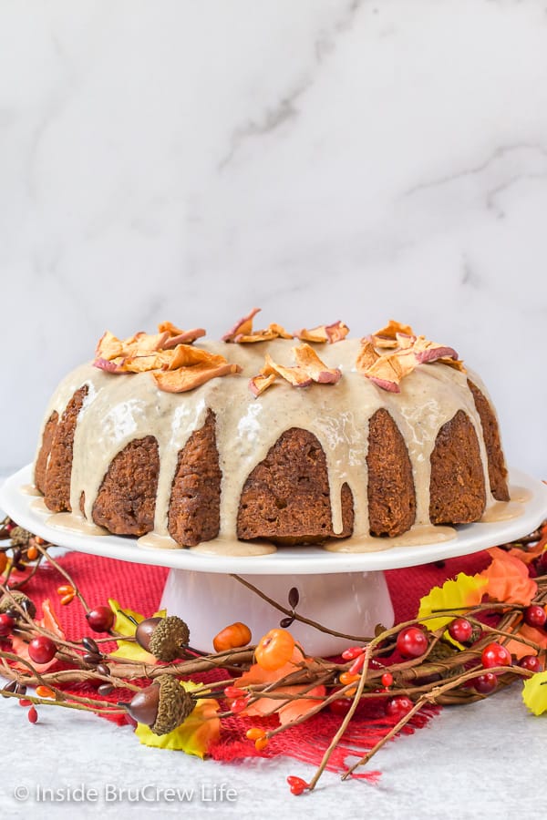 Toffee Apple Bundt Cake - shredded apples and toffee bits added to a homemade spice cake is the perfect fall dessert. Make this easy recipe for dessert or parties. #cake #bundtcake #apple #toffee #spicecake #homemade