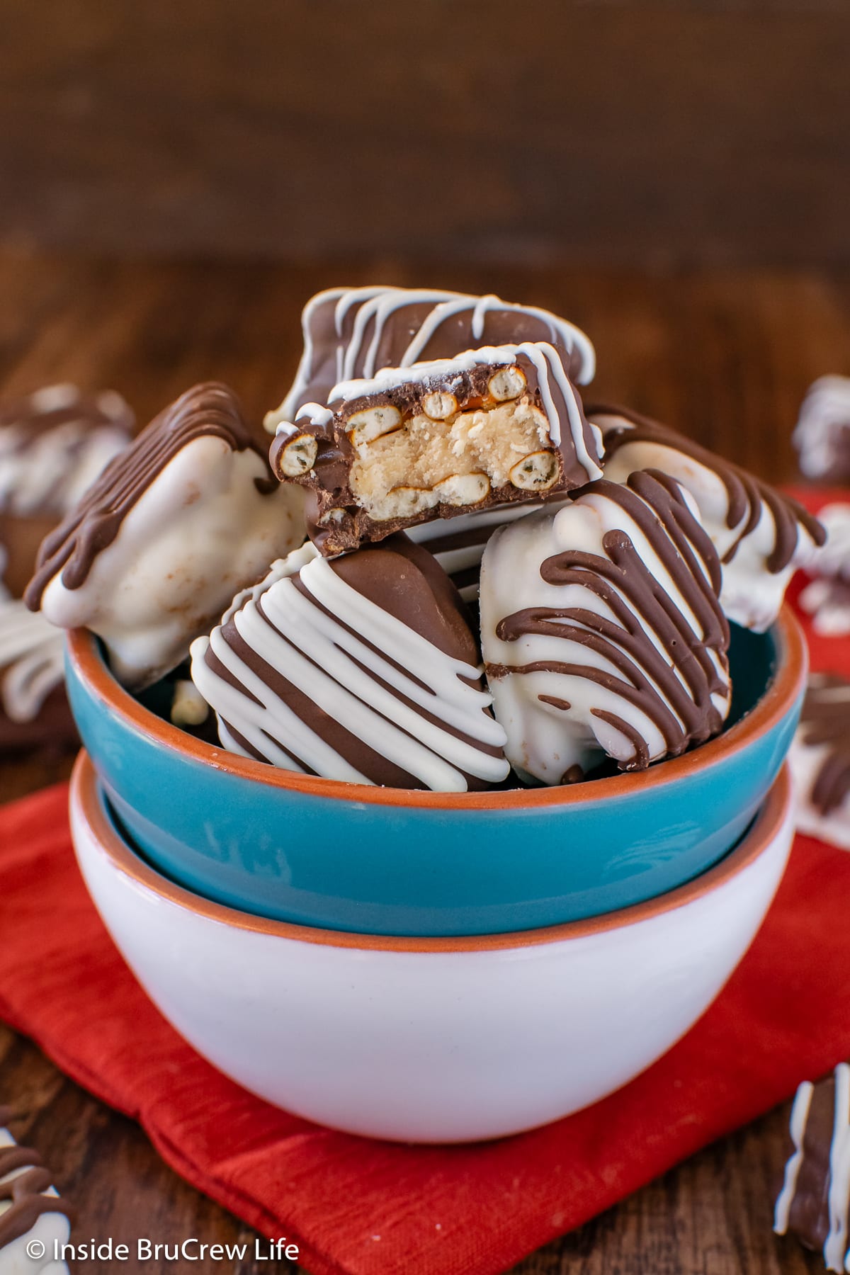Chocolate covered peanut butter pretzels inside a bowl.