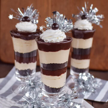 Three cups filled with coffee cheesecake and chocolate pudding.