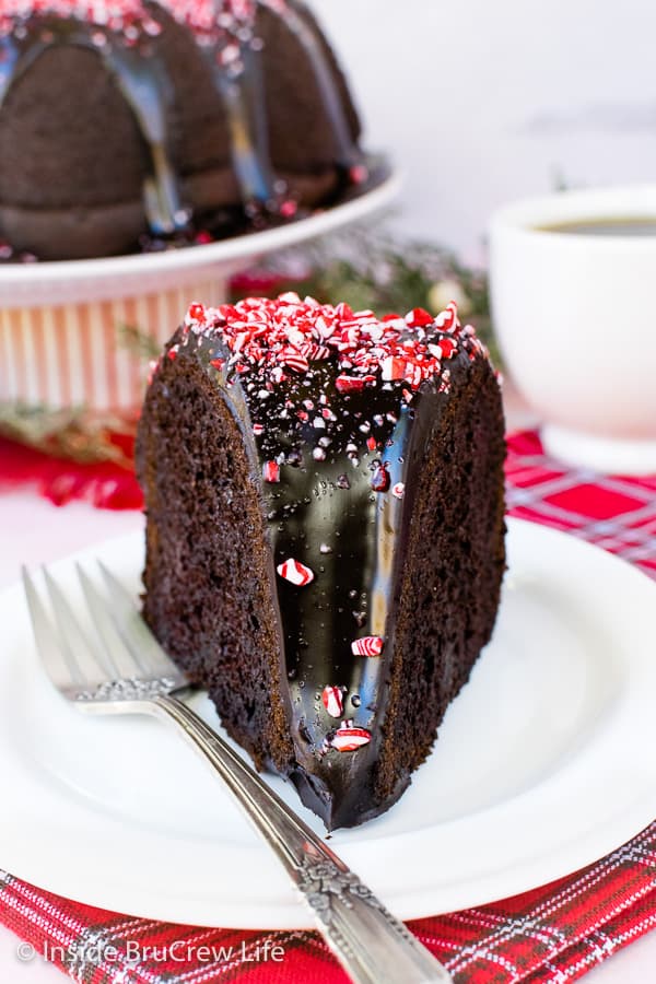 A white plate with a slice of peppermint mocha bundt cake on it.
