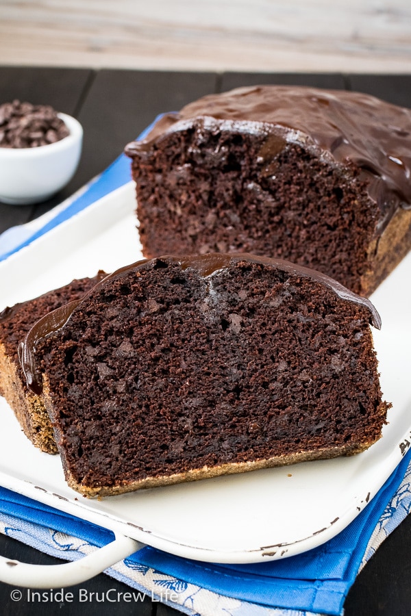 Slices of chocolate banana bread on a white tray.