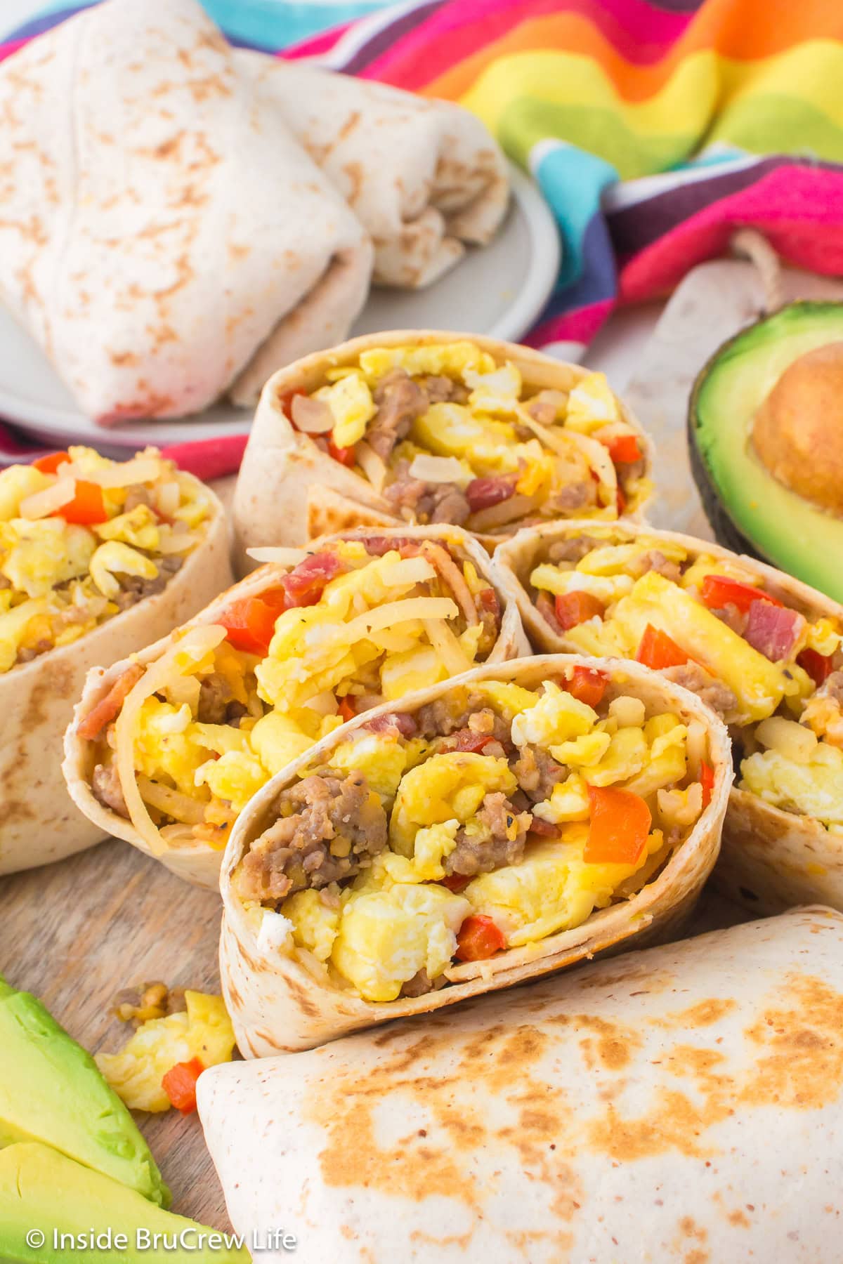 Egg burritos cut in half and on a tray.
