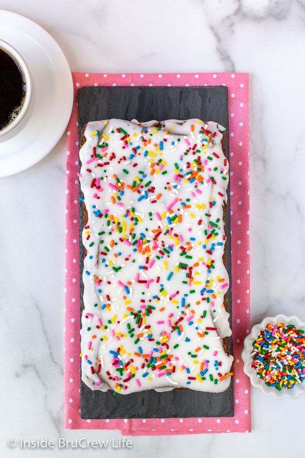 Funfetti Banana Bread - a sweet glaze and lots of sprinkles makes this easy banana bread so fun to make and eat. #banana #sweetbread #bananabread #funfetti #cakebatter #sprinkles