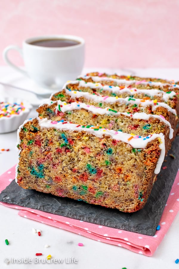 Funfetti Banana Bread - loads of colorful sprinkles and a sweet glaze make this sweet bread so fun to make and eat. Great recipe to use ripe bananas in. #banana #sweetbread #bananabread #funfetti #cakebatter #sprinkles