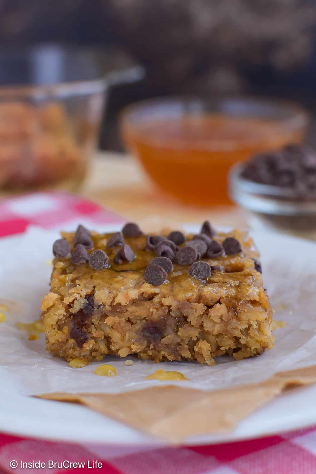 One square of peanut butter baked oatmeal with chocolate chips on top.