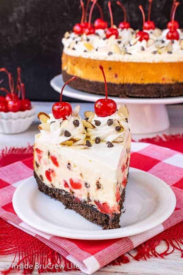 Almond Cherry Chip Cheesecake - this creamy cheesecake is loaded with cherries and chocolate chips. Make this impressive dessert for Valentine's day or Christmas and watch everyone smile. #cheesecake #almond #cherry #chocolatechip #valentinesday #holidaydessert #Christmas