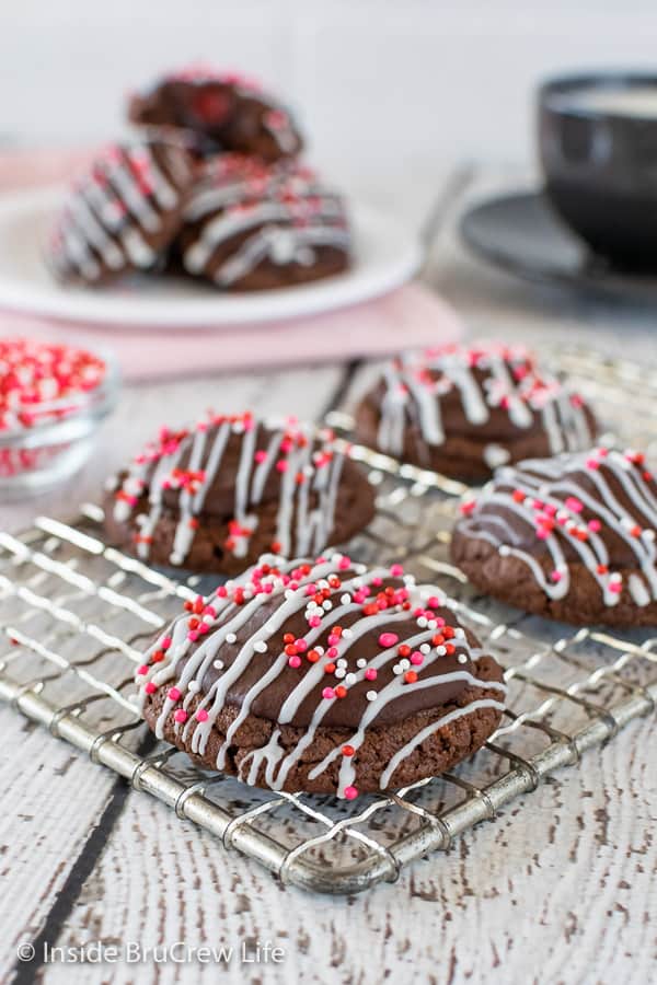 A wire rack with chocolate covered chocolate cookies.