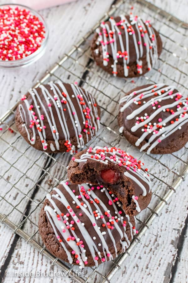 Chocolate cookies with white and milk chocolate drizzled on them.