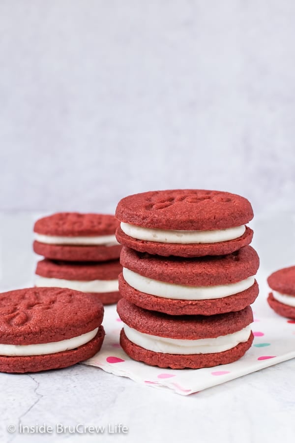 Copycat Red Velvet Oreos - these fun homemade Oreo cookies have a pretty red velvet color. Make and fill these cookies with a creamy frosting #redvelvet #Oreos #copycat #sandwichcookies #valentinesday #creamfilledcookies