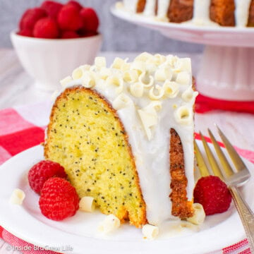 A slice of lemon bundt cake with lemon glaze on a white plate.