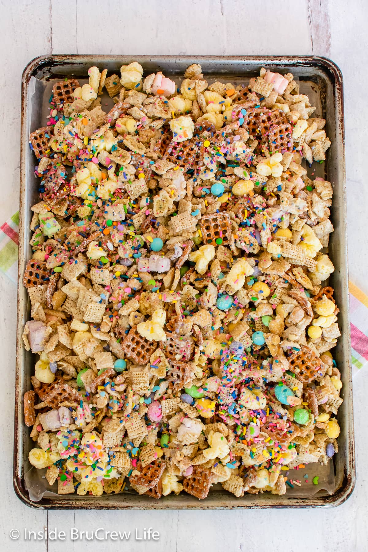 A pan of white chocolate snack mix with bunny mallows and graham crackers.
