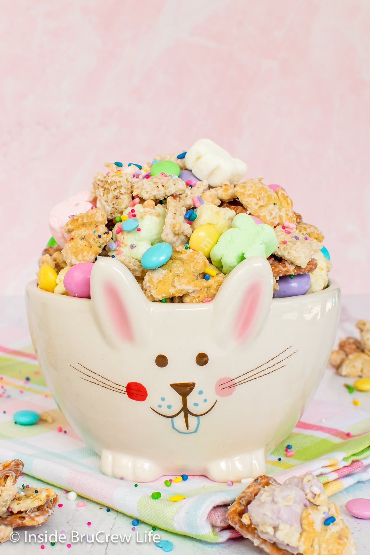 Snack mix inside a white bunny bowl.