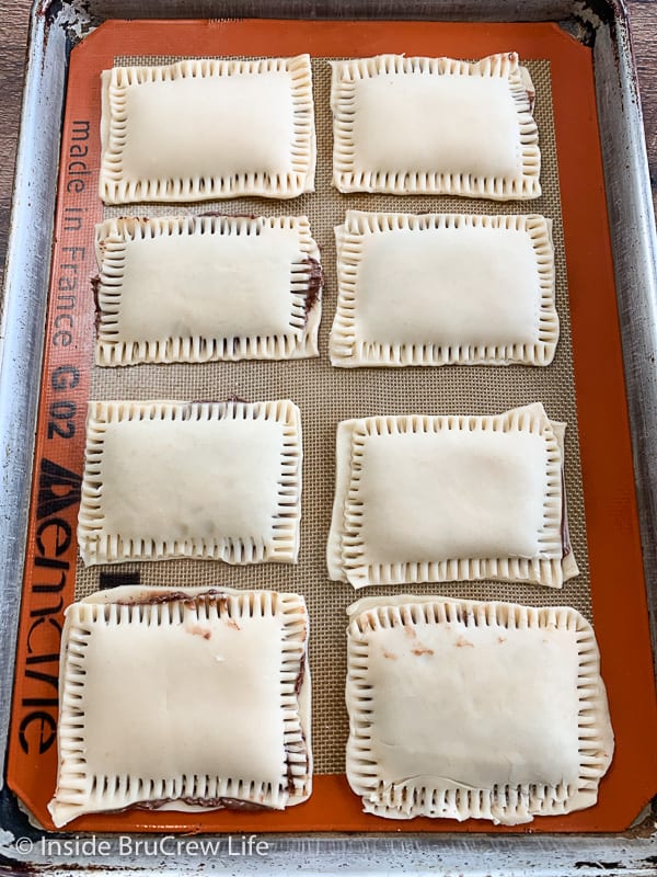 A baking sheet with homemade nutella pop tarts on it before baking